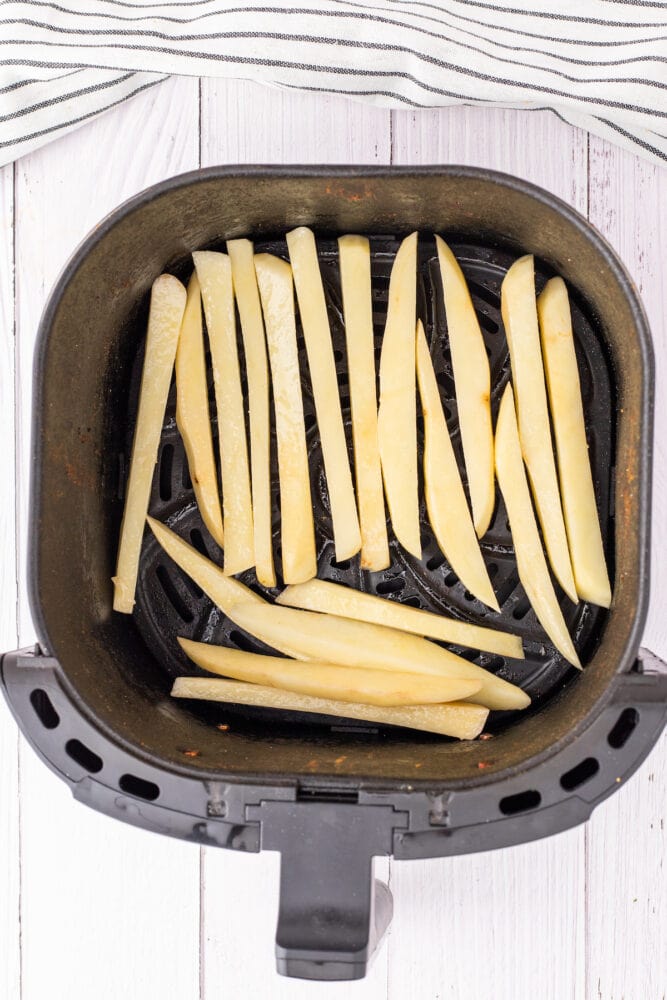 french fries in an air fryer basket