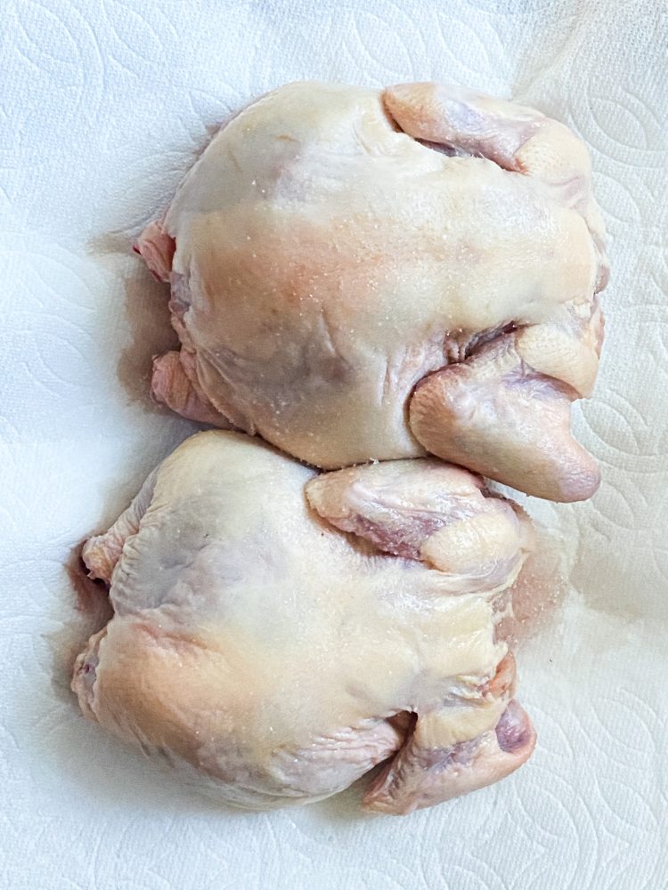 raw cornish game hens on paper towels