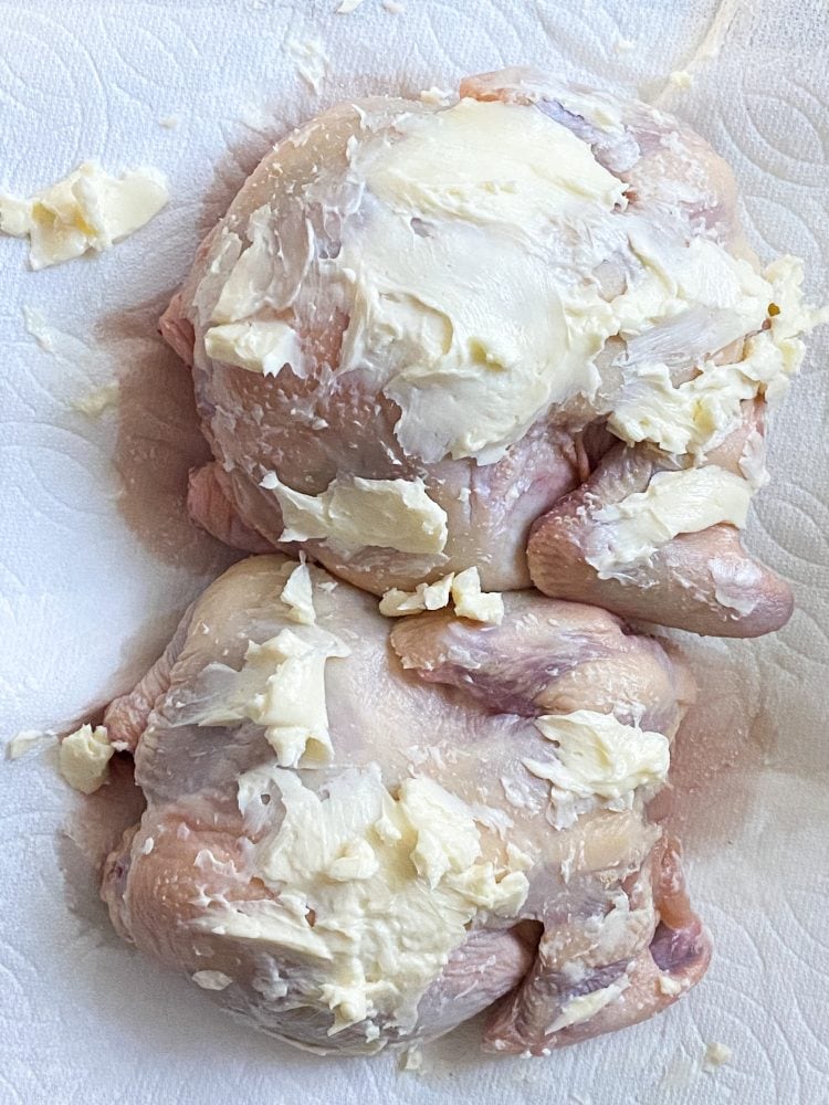 raw cornish game hens rubbed with butter