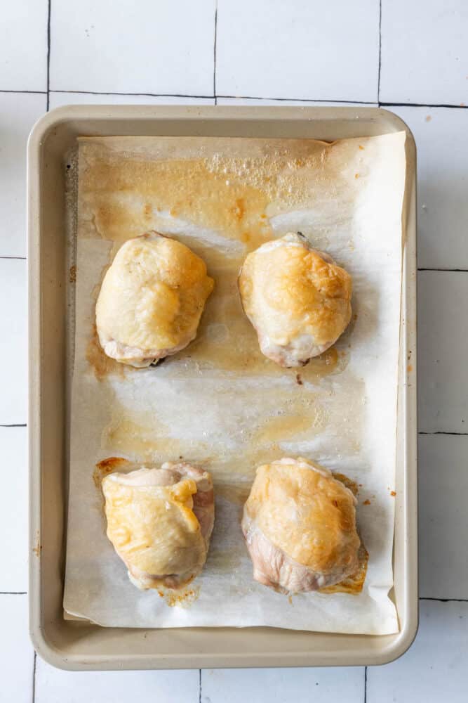 Baked Ranch Chicken Thighs on a tiled floor.