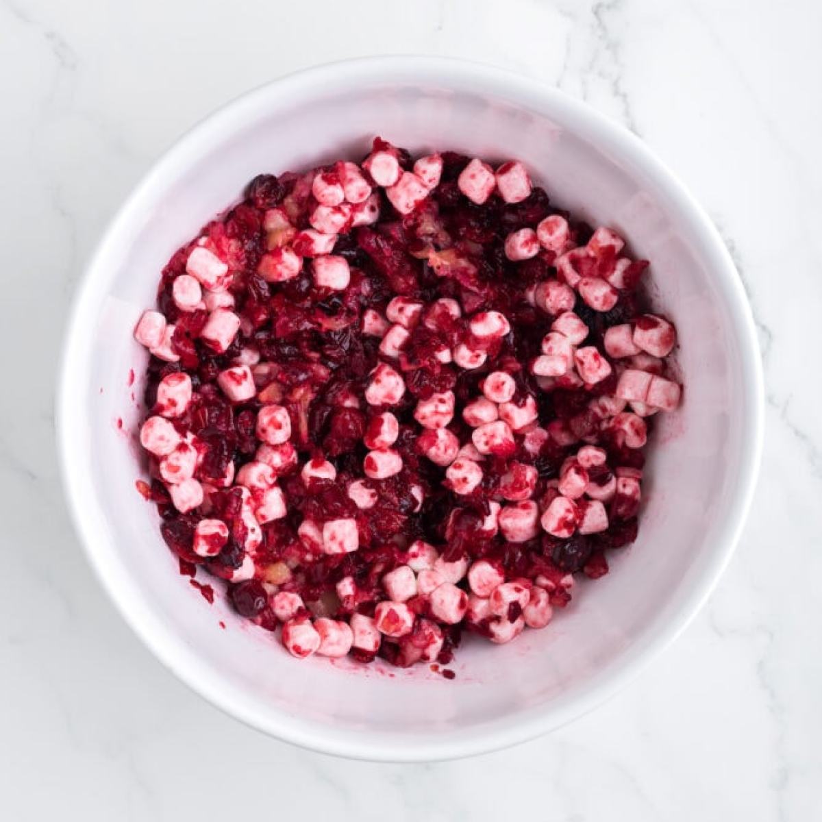 chopped cranberries and marshmallows in a bowl 