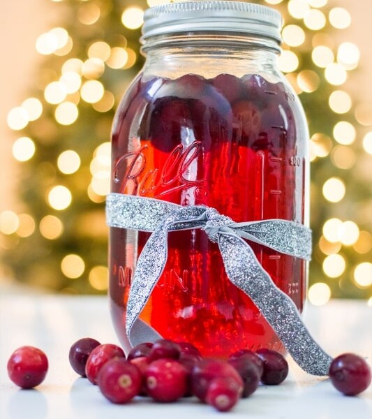 Cranberry-infused moonshine in a mason jar.