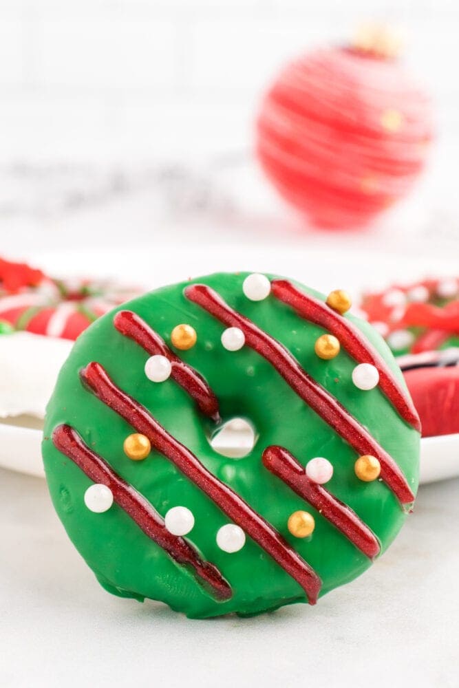 picture of a cookie decorated like a christmas wreath 