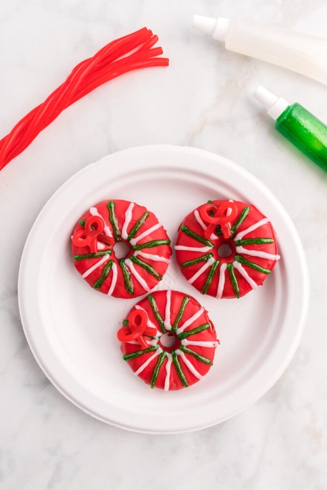 picture of cookies decorated like a red christmas wreath 