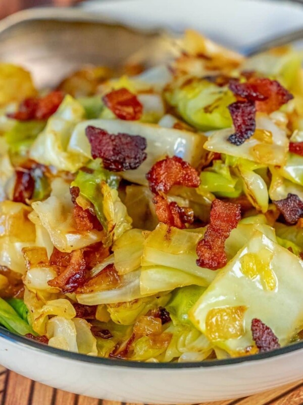 cabbage and bacon in a white bowl