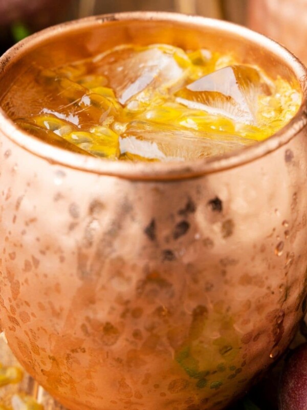 picture of passion fruit dark and stormy in copper mug