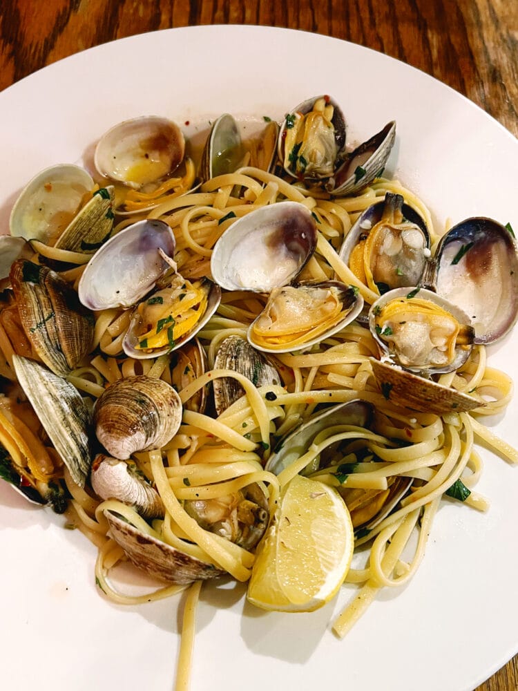 picture of clam pasta in a white bowl