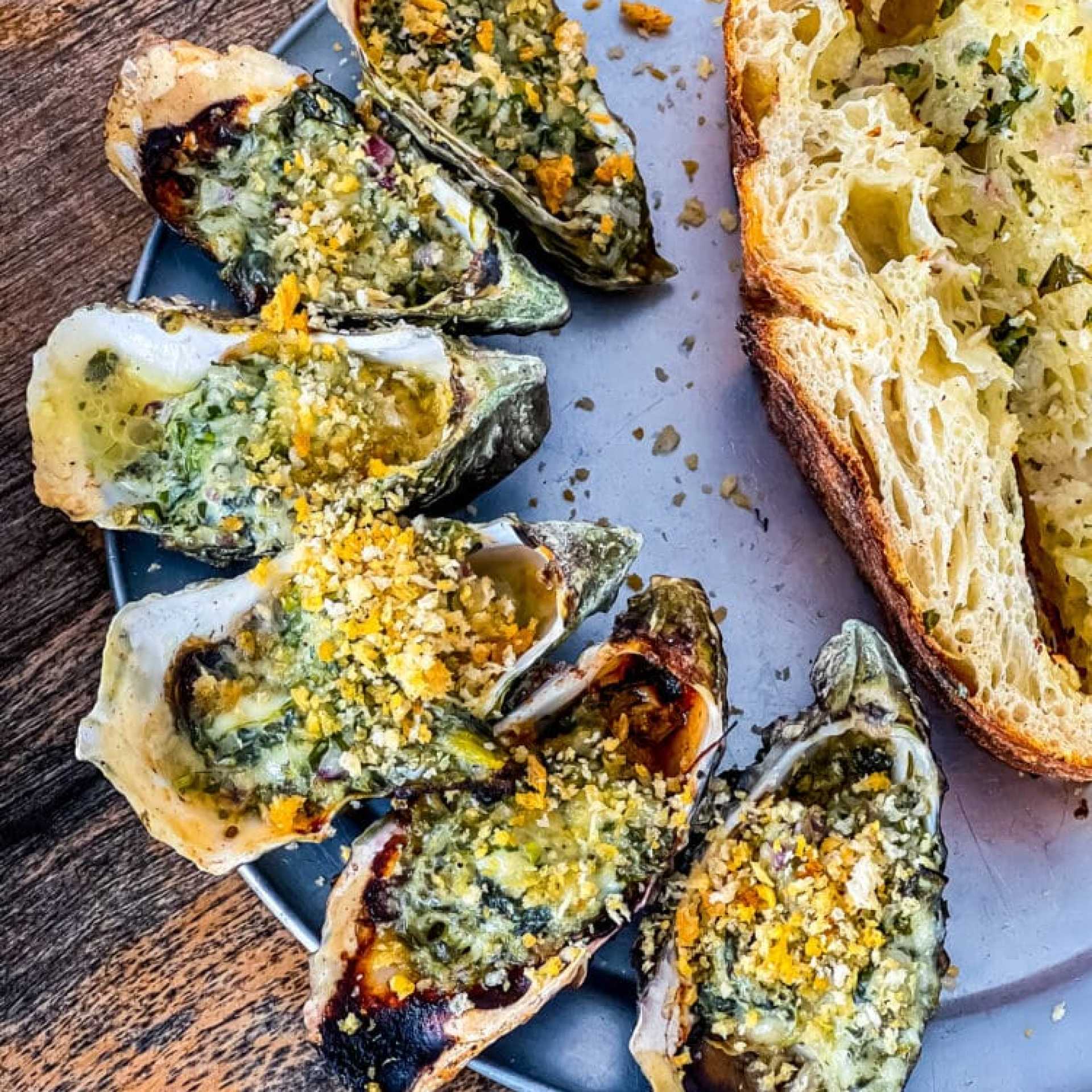 picture of oysters rockefeller on a metal plate from marshall store