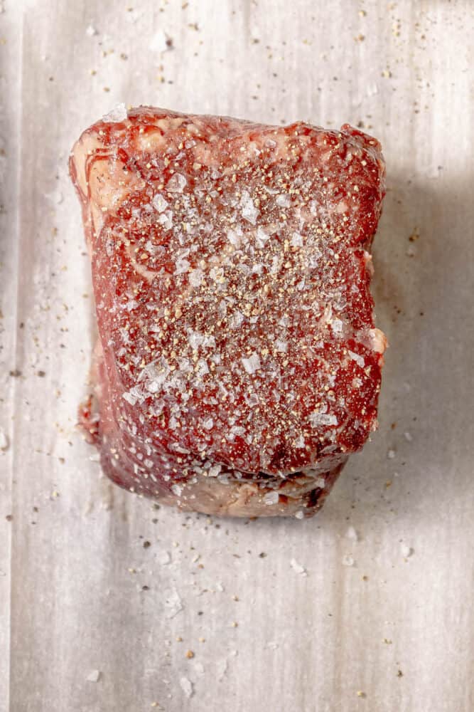 A Reverse Sear Filet Mignon is sitting on top of a piece of paper.