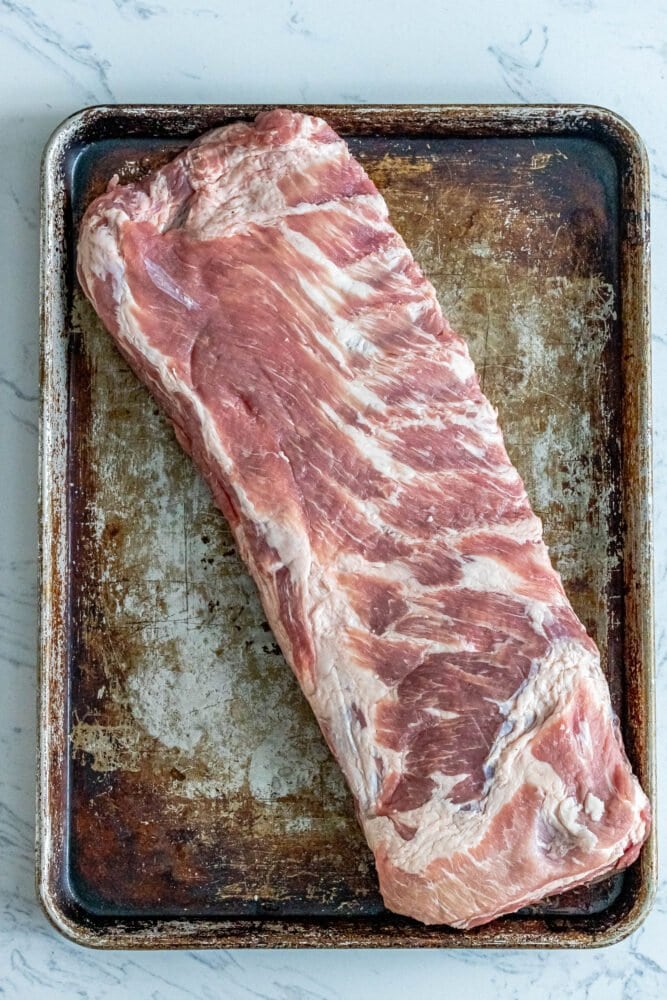 picture of raw ribs on a baking sheet